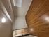 Inviting room featuring elegant hardwood floors, ample closet space, and natural light through a window with blinds.