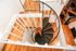 Elegant spiral staircase with sleek black steps, enhancing the modern interior charm.