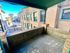 Charming balcony view showcasing classic architecture and a serene street scene, perfect for relaxation.