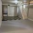 Charming basement space with checkered flooring and staircase, ideal for creative renovation opportunities.