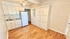 Charming studio apartment with modern kitchenette and sleek wood floors. Features built-in cabinetry and spacious feel.