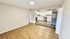 Bright open-concept living space with modern kitchen, sleek hardwood floors, and abundant natural light.