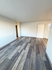 Chic apartment interior featuring modern vinyl flooring and a bright, open layout.