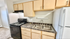 Charming kitchen with sleek appliances, modern cabinetry, and elegant countertops.