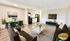 Modern, open-concept living area featuring a stylish kitchen, cozy dining space, and elegant seating in a bright apartment.