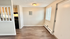 Charming apartment interior with modern open space, wood flooring, and ample natural light from large windows. Cozy atmosphere perfect for personalized decor.