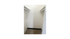Spacious walk-in closet with built-in shelves offering ample storage in a modern apartment.