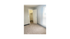 Bright bedroom with plush carpeting, large window, and walk-in closet.