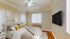 Bright and cozy bedroom featuring a plush bed, modern decor, and natural light, perfect for relaxation.