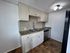 Modern kitchen with elegant cabinetry, granite countertops, and stainless steel appliances, offering a sleek and functional cooking space.