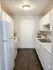 Sunridge Apartment Homes two bedroom apartment kitchen with white cabinets in Englewood CO