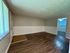 Inviting living area with elegant wood flooring and ample natural light.