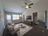 Inviting living room with plush seating, stylish decor, and abundant natural light from large windows.