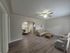 Cozy living and dining area with elegant archway, modern furnishings, and inviting natural light.