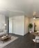 Bright and modern living area with elegant hardwood floors, cozy sofa, chic coffee table, and dining setup, leading to a stylish kitchen.