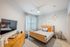 Furnished bedroom with bed and tables