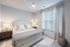 Furnished bedroom with bed and tables