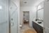 Furnished bathroom with walk-in shower