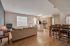 Bright and airy open-concept living room with a modern kitchen and dining area.