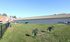Spacious dog park area with agility equipment and seating, ideal for outdoor fun.