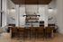 Modern kitchen interior with stylish bar stools, pendant lighting, and sleek cabinetry.