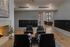 Inviting lounge area with modern seating, cozy fireplace, and elegant decor.