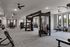 Spacious modern gym with state-of-the-art exercise equipment and natural lighting.