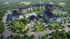 Aerial view of elegantly designed apartment complex with lush greenery, parking spaces, and a central pool area.