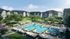Modern apartment complex featuring a large outdoor pool area surrounded by greenery.