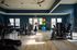 Bright, modern gym with state-of-the-art exercise equipment and stylish decor.