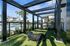Inviting outdoor gym with modern exercise equipment overlooking a luxurious swimming pool area.