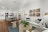 Inviting open-concept living and kitchen area with modern furniture and natural lighting.