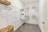 Modern walk-in closet with wire shelving and ample storage space.