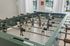 Contemporary foosball table in a bright, stylish lounge area.