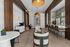 Luxurious lounge with elegant seating, wood accents, and a stylish bar area.