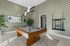 Chic game room featuring a modern billiard table, geometric wallpaper, and stylish decor.