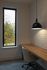 Inviting workspace with wooden desk under a modern pendant light and a window view of nature.