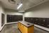 Secure and modern mailroom with organized mailboxes and sleek lighting, providing convenience for residents.