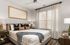 Cozy and elegant bedroom with a plush bed, stylish decor, and ample natural light, creating a serene and inviting atmosphere.