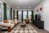 Elegant living room with plush seating, large windows, and modern decor; a perfect blend of comfort and style.