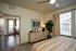 Inviting bedroom with elegant decor, abundant natural light, and cozy atmosphere, perfect for relaxation.