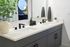 Luxurious bathroom with dual sinks, modern fixtures, elegant decor, and a sleek mirror adding sophistication.
