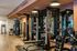 Modern fitness center with state-of-the-art equipment, weights, and vibrant workout accessories for an energetic lifestyle.