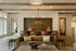 Modern and inviting apartment lobby featuring stylish leather seating, elegant decor, and warm wood accents, perfect for welcoming guests.