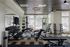 Modern fitness center with state-of-the-art gym equipment, sleek design, and ample natural light.