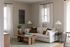 Chic living room with a plush beige sofa, elegant wooden coffee table, and stylish decor creating a cozy ambiance.