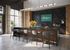 Sleek, modern apartment kitchen with elegant dark countertops, ample seating at the island, and a welcoming, bright ambiance.