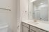 Bathroom with grey cabinets