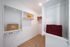 Luxurious and spacious walk-in closet with sleek shelving and ample storage, perfect for organizing personal items in a modern apartment.