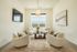 Inviting and bright living room with modern furniture, large window view, and elegant decor enhancing a serene ambiance.